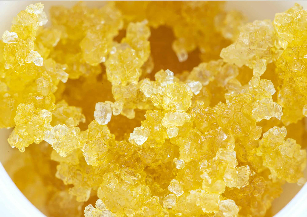 Close-up of yellow crystalline cannabis concentrate