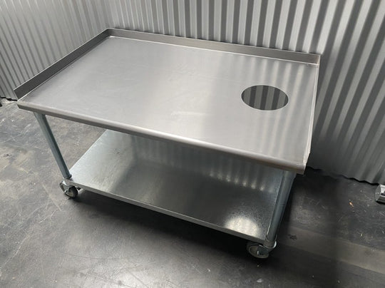 Stainless steel equipment stand with a drilled top and lower shelf
